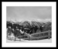 Black and white photograph of an open alpine landscape with wooden fencing in the High Tauern range, conveying spatial calm, from the series High Tauern. The Zone Studies X by Ziggy Kanczukowski